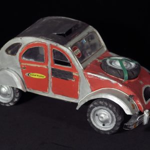 Red Citroen Deux Chevaux with a flat tire