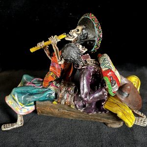 Two Musicians on a Log - calavera sculpture